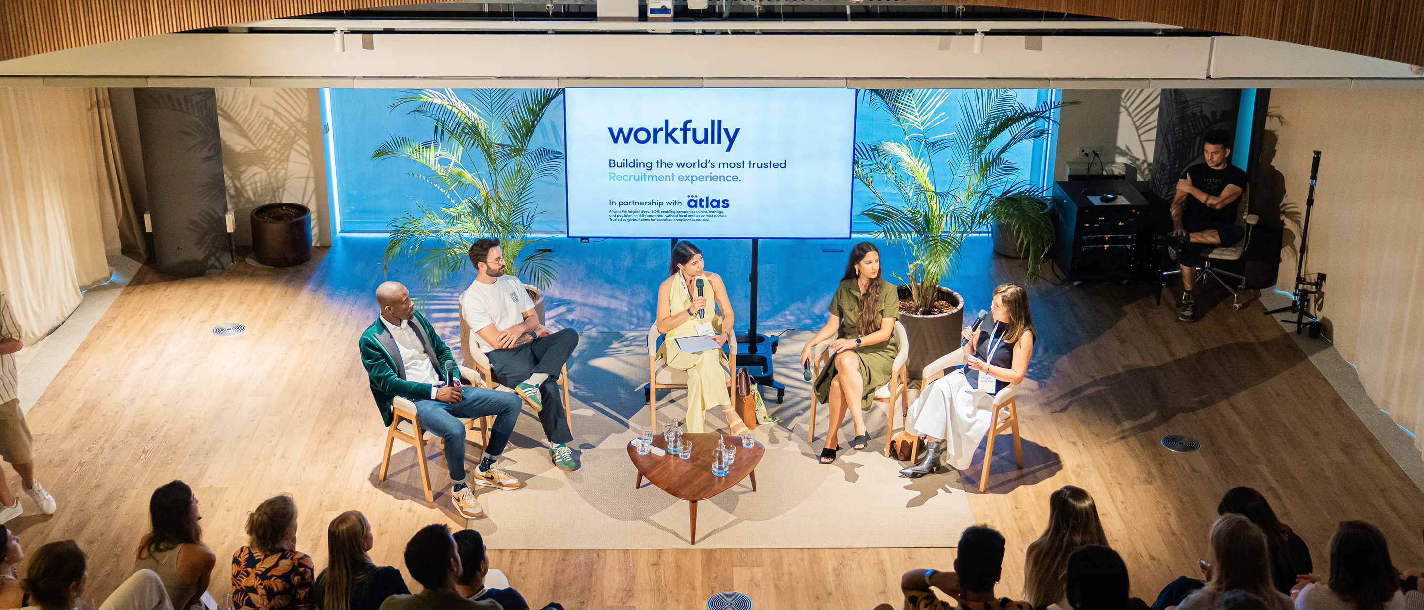 Panel discussion on stage at a professional conference