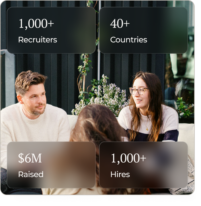 Colleagues in discussion in a bright, modern workspace