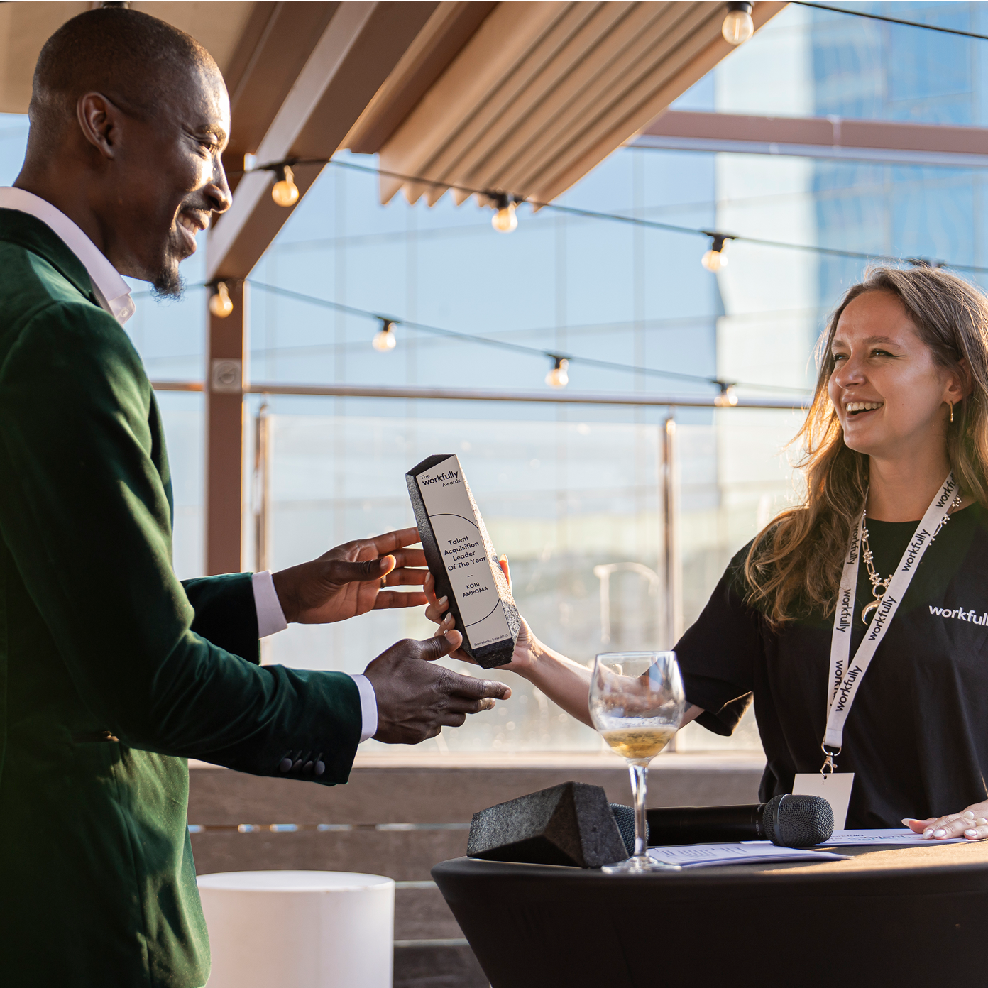 Workfully event attendee receiving an award on stage