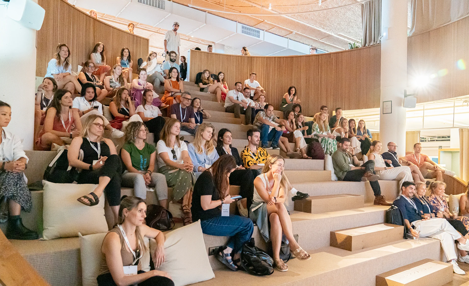 Audience seated in amphitheater-style event space