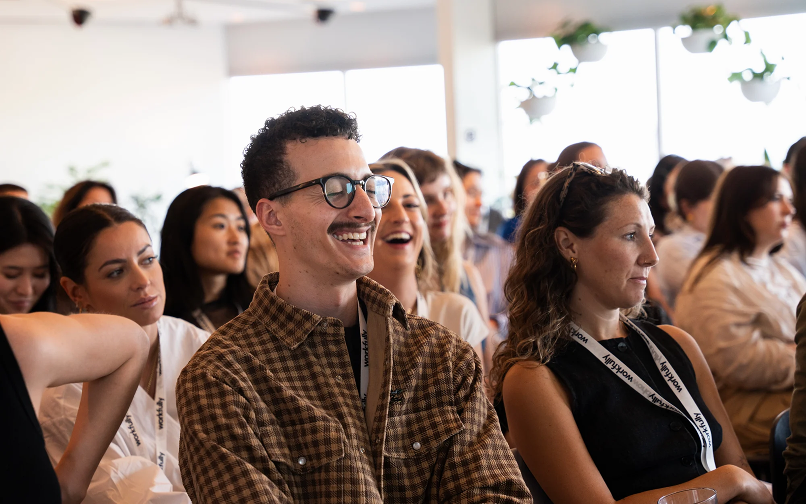Participants engaged in a live talk at a community event