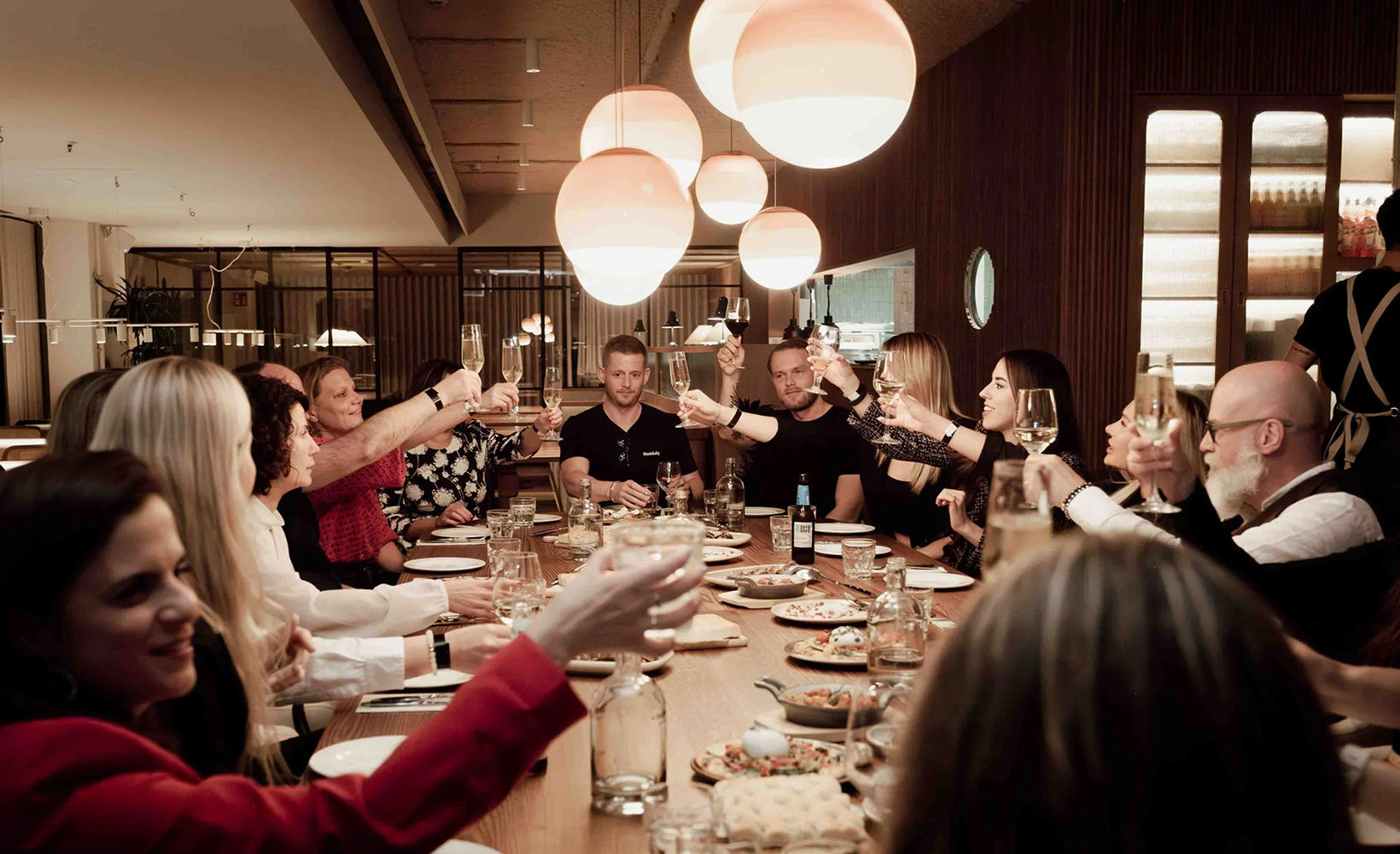Dinner table toast at a Workfully networking event